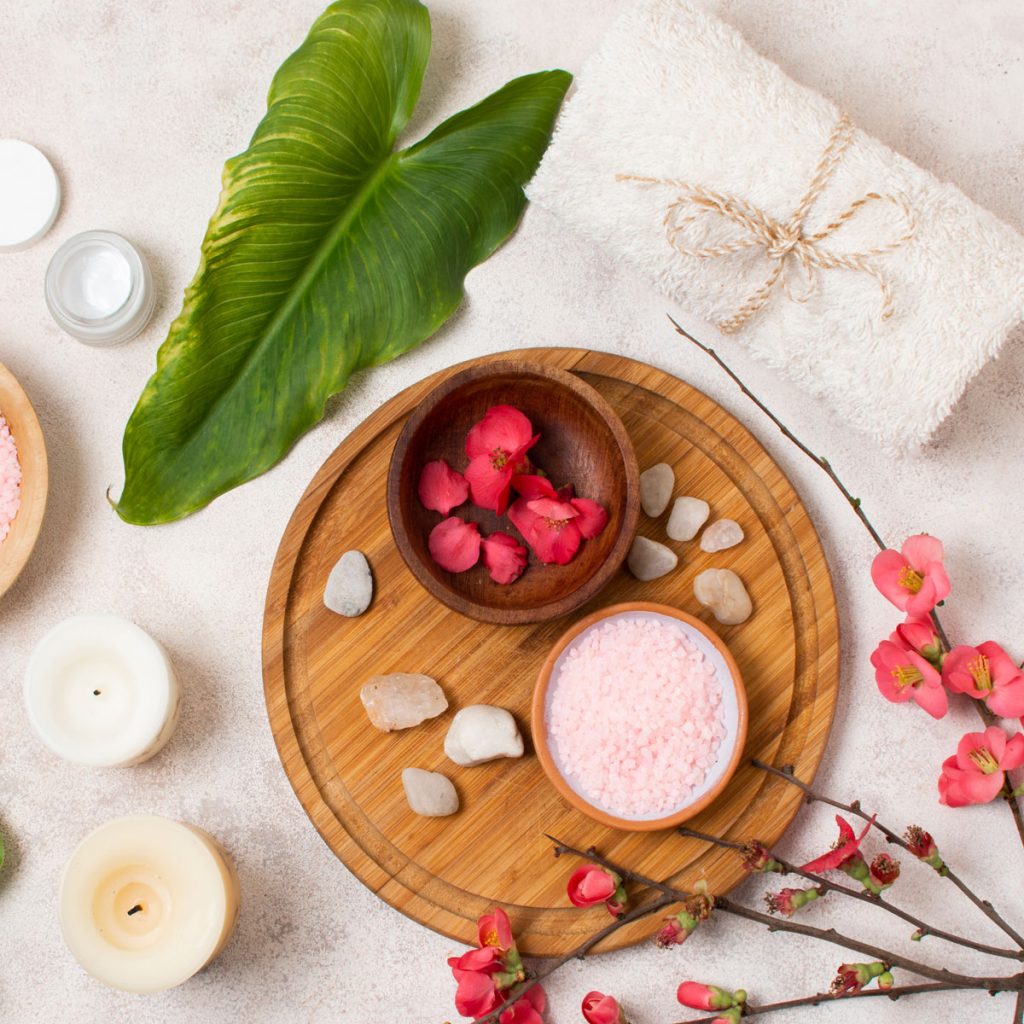 flat lay spa composition with flowers candles